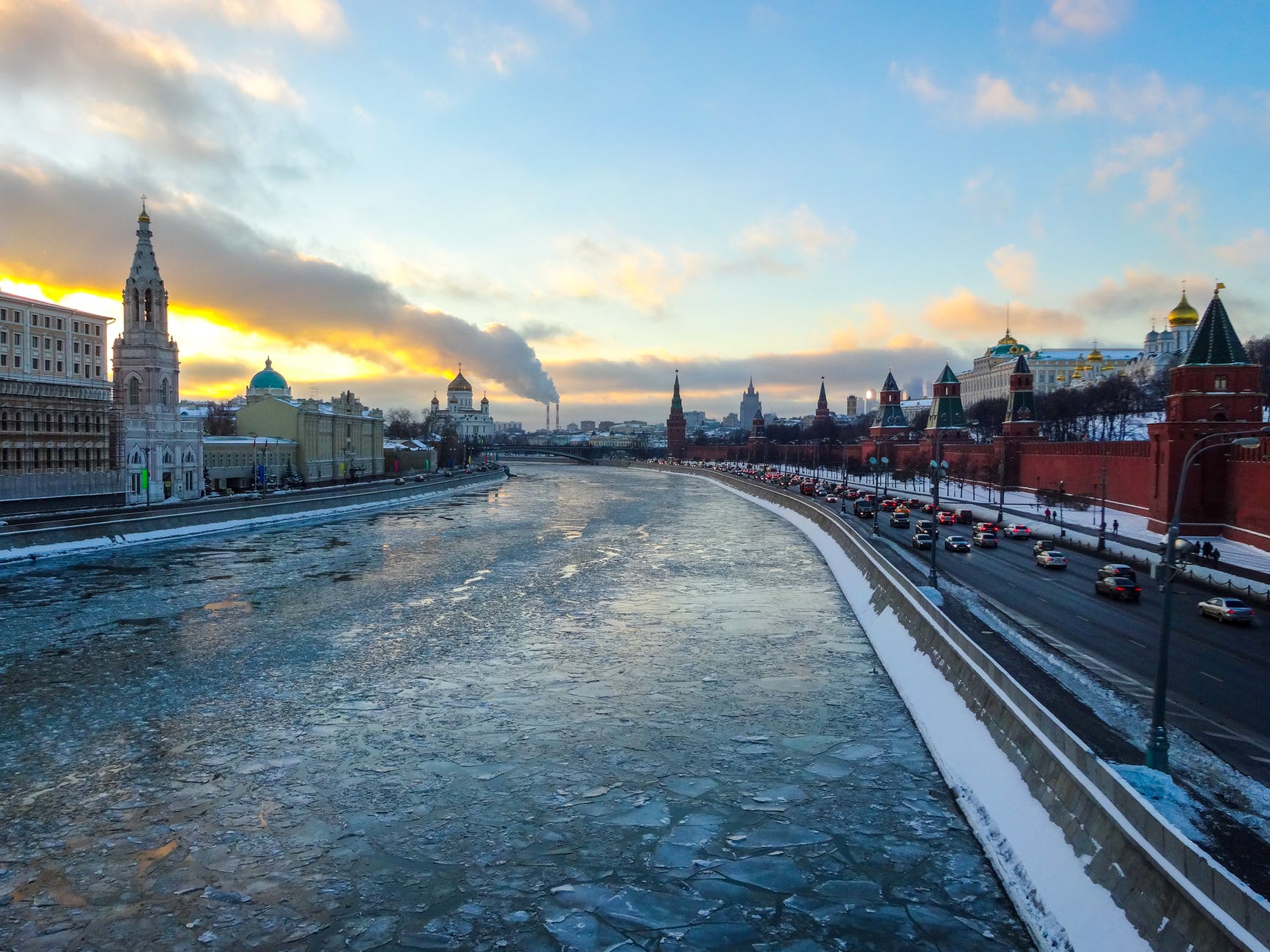 a river in a city covered in broken ice