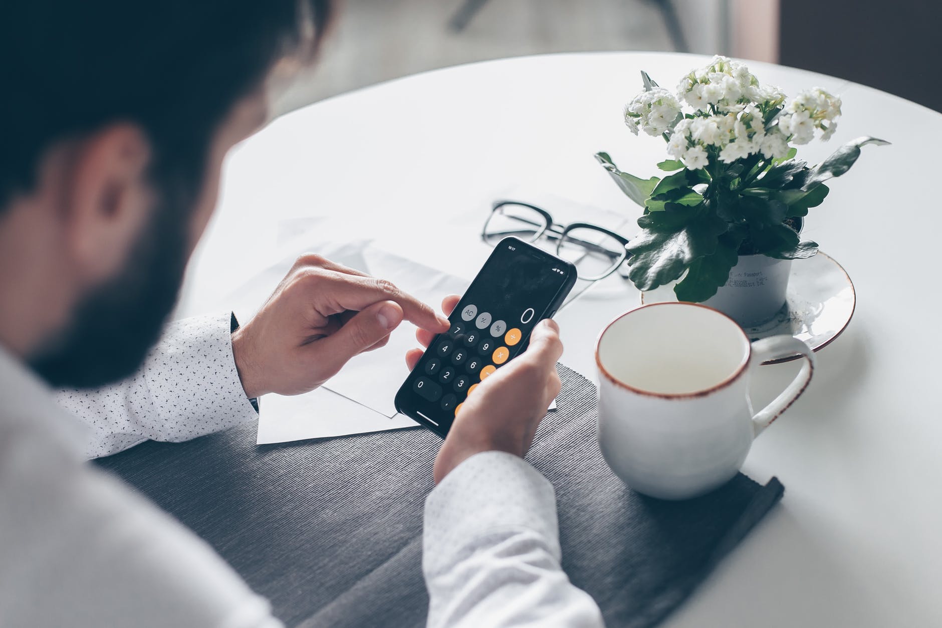 person holding black remote control