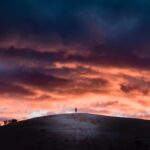 person on top of a hill